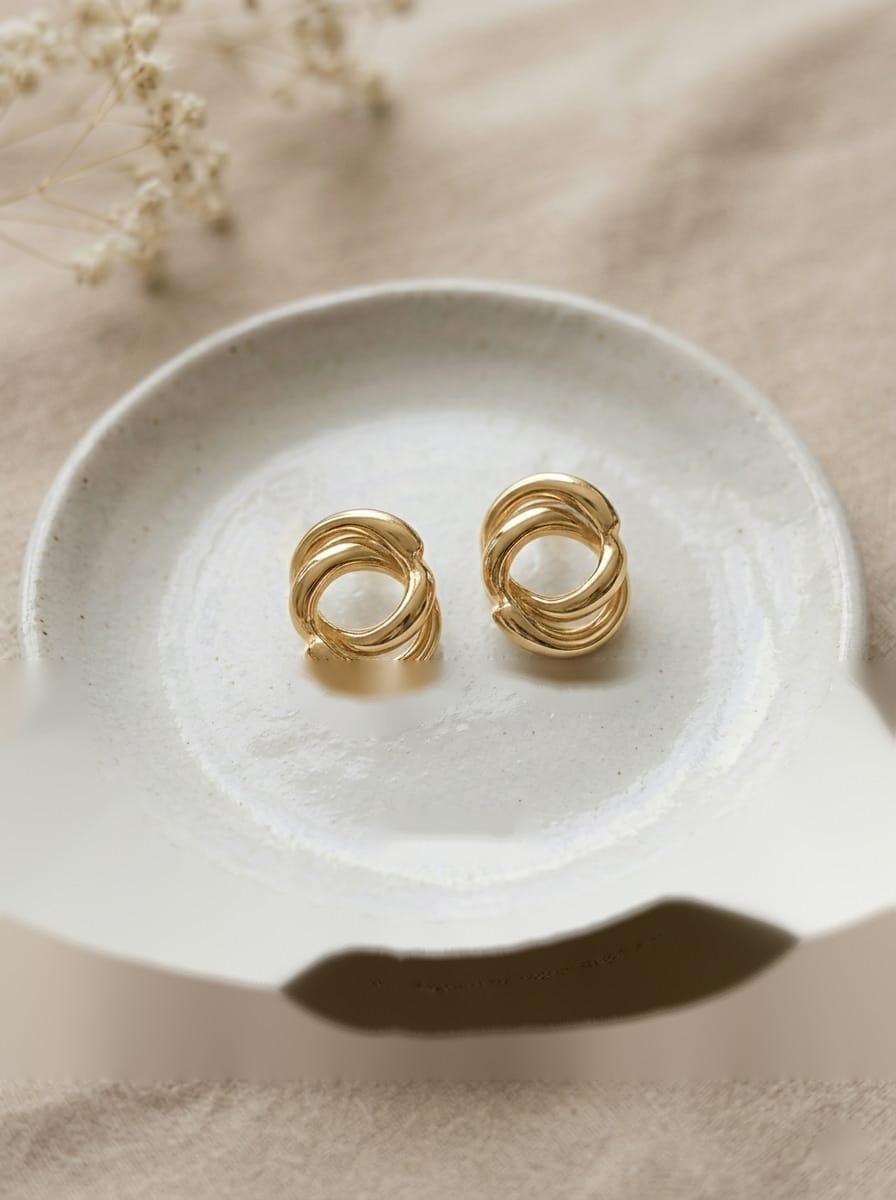 Gold Swirl Knot Studs by aambish Jwelles